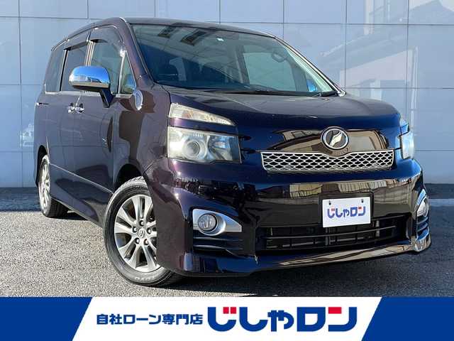 トヨタ ヴォクシー ZS 煌 埼玉県 2011(平23)年 9.5万km ボルドーマイカメタリック (株)IDOMが運営する【じしゃロン熊谷店】の自社ローン専用車両になりますこちらは現金またはオートローンご利用時の価格です。自社ローンご希望の方は別途その旨お申付け下さい/純正ナビ　/（CD/DVD/MSV/SD/BT/フルセグ/ラジオ）　/バックカメラ　/両側パワースライドドア　/ビルトインETC/ステアリングスイッチ /パドルシフト　/オートライト /純正16インチAW /スマートキー  /スペアキー /全席オートウインドウ/ドアバイザー/保証書　/取扱説明書