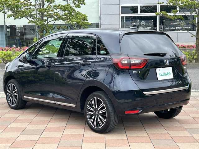 ホンダ フィット e:HEVリュクス 福島県 2020(令2)年 3.2万km ミッドナイトブルービームM 4WD/ホンダセンシング/衝突軽減ブレーキ〈CMBS〉/誤発進抑制機能/後方誤発進抑制機能/近距離衝突軽減ブレーキ/歩行者事故低減ステアリング/路外逸脱抑制機能/渋滞追従機能付アダプティブ・クルーズ・コントロール〈ACC〉/車線維持支援システム〈LKAS〉/先行車発進お知らせ機能/標識認識機能/オートハイビーム/純正ナビゲーション/型番：VXM-205Ci/【CD/SD/USB/BT】/バックカメラ/ドライブレコーダー/ビルトインETC/前席シートヒーター/ステアリングヒーター/LEDオートライト/LEDフォグランプ/純正フロアマット/ドアバイザー