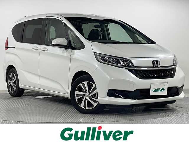 ホンダ フリード ハイブリット G 広島県 2023(令5)年 1.9万km プラチナホワイトパール 禁煙/１０型ナビ/両側パワースライドドア　/バックカメラ　/シートヒーター（D/N）/ハーフレザー/レーダークルーズコントロール/コーナーセンサー/ＥＴＣ/衝突軽減/レーンキープアシスト/オートライト/ＬＥＤヘッドライト