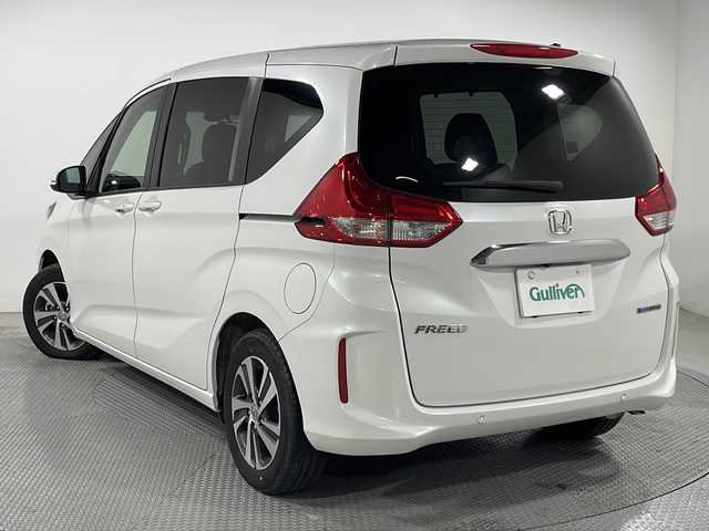 ホンダ フリード ハイブリット G 広島県 2023(令5)年 1.9万km プラチナホワイトパール 禁煙/１０型ナビ/両側パワースライドドア　/バックカメラ　/シートヒーター（D/N）/ハーフレザー/レーダークルーズコントロール/コーナーセンサー/ＥＴＣ/衝突軽減/レーンキープアシスト/オートライト/ＬＥＤヘッドライト