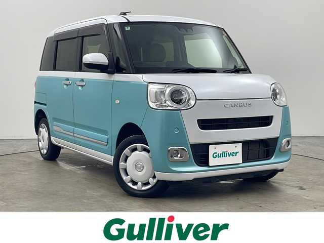 ダイハツ ムーヴ キャンバス ストライプス G 秋田県 2022(令4)年 1.7万km シャイニングホワイトパール/ファインミントメタリック 4WD/スマートアシスト/社外SDナビ/　　CD/DVD/Bluetooth/フルセグ/バックカメラ/両側パワースライドドア/LEDオートライト/LEDフォグランプ/オートマチックハイビーム/前席シートヒーター/コーナーセンサー/純正フロアマット/スマートキー