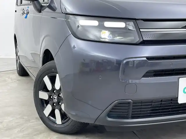 ホンダ フリード ハイブリット e:HEV AIR EX 新潟県 2025(令7)年 0.1千km メテオロイドグレーメタリック 4WD/純正9インチメモリナビ【LXM-242ZFNI】/　フルセTV/Bluetooth/AppleCarPlay/AndroidAuto/ブラインドスポットインフォメーション/踏み間違い衝突軽減システム/レーダークルーズコントロール/衝突被害軽減ブレーキ/レーンキープアシスト/前後コーナーセンサー/両側パワースライドドア/前席シートヒーター/バックモニター/リアクーラー/横滑り防止装置/LEDヘッドライト/オートマチックハイビーム/オートライト/レザーステアリング/ステアリングスイッチ/禁煙車