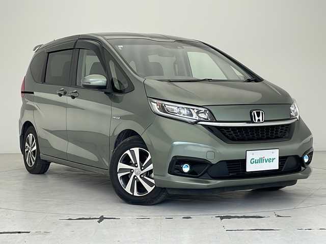 ホンダ フリード ハイブリット G ホンダセンシング 沖縄県 2020(令2)年 6.6万km シルバーミストグリーンM 純正ナビ(VXM-204VFi)/（フルセグＴＶ　ラジオ　ＣＤ　ＤＶＤ　Ｂｌｕｅｔｏｏｔｈ）/バックカメラ/ドライブレコーダー/ＥＴＣ/ホンダセンシング/ステアリングスイッチ/クルーズコントロール/両側パワースライドドア/ＬＥＤヘッドライト/オートライト/クリアランスソナー/スマートキー/プッシュスタート/純正フロアマット/純正15インチアルミホイール/保証書