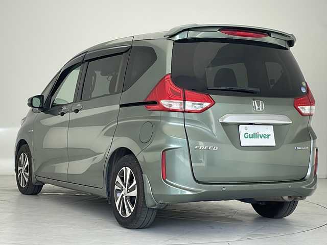 ホンダ フリード ハイブリット G ホンダセンシング 沖縄県 2020(令2)年 6.6万km シルバーミストグリーンM 純正ナビ(VXM-204VFi)/（フルセグＴＶ　ラジオ　ＣＤ　ＤＶＤ　Ｂｌｕｅｔｏｏｔｈ）/バックカメラ/ドライブレコーダー/ＥＴＣ/ホンダセンシング/ステアリングスイッチ/クルーズコントロール/両側パワースライドドア/ＬＥＤヘッドライト/オートライト/クリアランスソナー/スマートキー/プッシュスタート/純正フロアマット/純正15インチアルミホイール/保証書