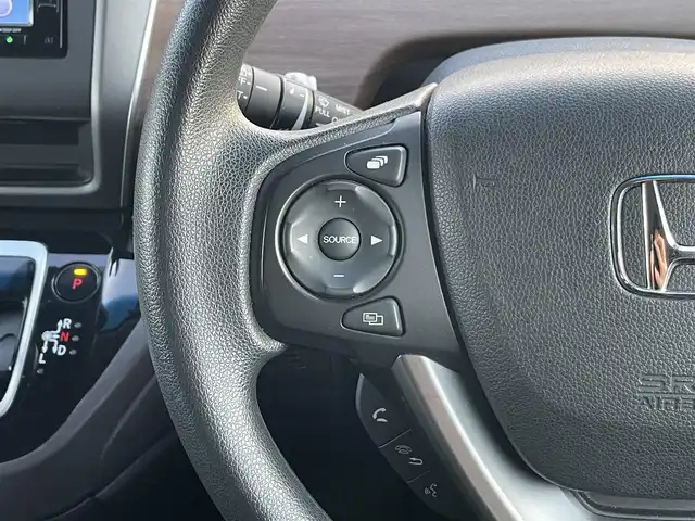 ホンダ フリード ハイブリット G ホンダセンシング 岡山県 2020(令2)年 6.9万km クリスタルブラックパール 登録時走行距離：　68766km/ワンオーナー/禁煙車/純正SDナビ(型番：VXM-204VFi)/　(CD/DVD/フルセグTV/Bluetooth)/バックカメラ/クルーズコントロール(追従走行あり)/衝突被害軽減システム/車線逸脱警報/先行車発進お知らせ機能/ETC/両側パワースライドドア/シートヒーター/ステアリングスイッチ/純正LEDヘッドライト/フォグライト/オートライト/プッシュスタート/スマートキー/アイドリングストップ/ドアバイザー/ウインカーミラー/電動格納ミラー/純正フロアマット/横滑防止装置/盗難防止装置/取扱説明書/新車時整備手帳（保証書）