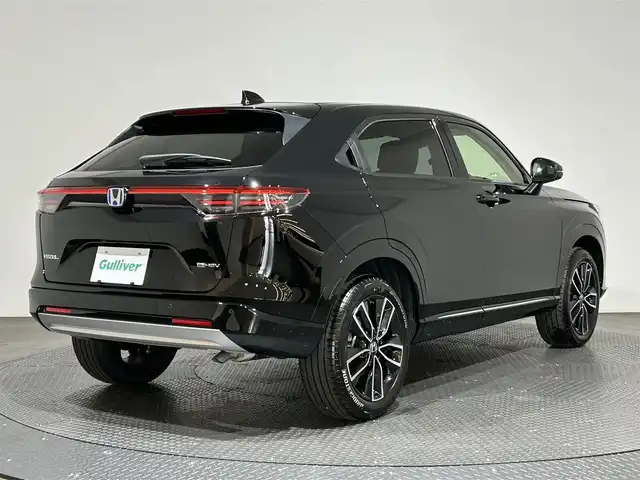 ホンダ ヴェゼル ハイブリッド e:HEV Z 愛媛県 2025(令7)年 0.1万km クリスタルブラックパール ・Honda SENSING	/・ブラインドスポットインフォメーション/・アダプティブドライビングビーム(ADB)/ ・Honda CONNECT for Gathers＋ナビ装着用スペシャルパッケージ/（フルセグTV・BT・FM・AM・applecarplay・android auto・USB）/・運転席助手席シートヒーター/・ハンズフリーアクセスパワーテールゲート(予約クローズ機能付)/・LEDシーケンシャルターンシグナルランプ/・18インチアルミホイール/・コンビシート/・本革巻きステアリング/・衝突軽減ブレーキ/・レーダークルーズコントロール/・オートマチックハイビーム/・ステアリングヒーター/・スペアキー
