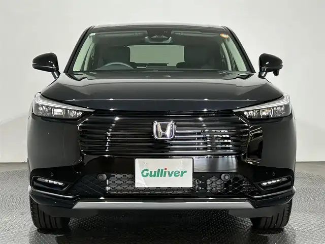ホンダ ヴェゼル ハイブリッド e:HEV Z 愛媛県 2025(令7)年 0.1万km クリスタルブラックパール ・Honda SENSING	/・ブラインドスポットインフォメーション/・アダプティブドライビングビーム(ADB)/ ・Honda CONNECT for Gathers＋ナビ装着用スペシャルパッケージ/（フルセグTV・BT・FM・AM・applecarplay・android auto・USB）/・運転席助手席シートヒーター/・ハンズフリーアクセスパワーテールゲート(予約クローズ機能付)/・LEDシーケンシャルターンシグナルランプ/・18インチアルミホイール/・コンビシート/・本革巻きステアリング/・衝突軽減ブレーキ/・レーダークルーズコントロール/・オートマチックハイビーム/・ステアリングヒーター/・スペアキー