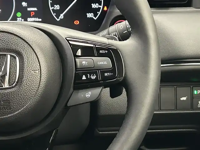ホンダ ヴェゼル ハイブリッド e:HEV Z 愛媛県 2025(令7)年 0.1万km クリスタルブラックパール ・Honda SENSING	/・ブラインドスポットインフォメーション/・アダプティブドライビングビーム(ADB)/ ・Honda CONNECT for Gathers＋ナビ装着用スペシャルパッケージ/（フルセグTV・BT・FM・AM・applecarplay・android auto・USB）/・運転席助手席シートヒーター/・ハンズフリーアクセスパワーテールゲート(予約クローズ機能付)/・LEDシーケンシャルターンシグナルランプ/・18インチアルミホイール/・コンビシート/・本革巻きステアリング/・衝突軽減ブレーキ/・レーダークルーズコントロール/・オートマチックハイビーム/・ステアリングヒーター/・スペアキー