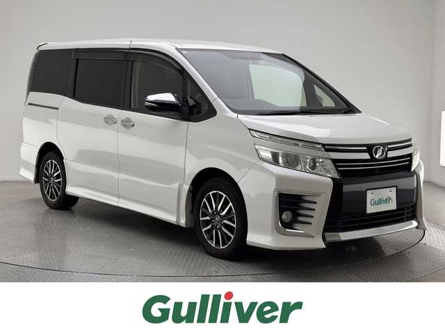 トヨタ ヴォクシー ZS 煌 兵庫県 2015(平27)年 10.7万km ホワイトパールクリスタルシャイン 社外メモリナビ/フルセグ CD DVD BT MSV/バックカメラ/両側パワースライドドア/ETC/LEDヘッドライト/フォグライト/オートライト/純正フロアマット/純正ドアバイザー/純正16インチアルミホイール/スマートキー