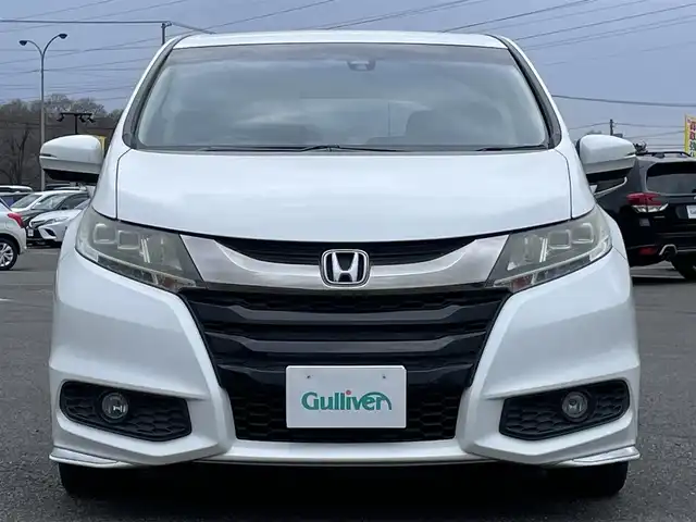 ホンダ オデッセイ アブソルート 20thアニバーサリー 道央・札幌 2014(平26)年 11.1万km ホワイトオーキッドパール 社外メモリーナビ/BT/SD/CD/DVD/社外フリップダウンモニター/衝突被害軽減ブレーキ/横滑り防止装置/クルーズコントロール/ビルトインETC/アイドリングストップ/両側パワースライドドア/D席パワーシート/オットマン/ハーフレザーシート/革巻きステアリング/ステアリングリモコン/パドルシフト/MTモード付AT/レーダー探知機/プッシュスタート/スマートキー/LEDヘッドライト/オートライト/フォグランプ/電動格納ミラー/ヒーテッドドアミラー/ウィンカーミラー/純正フロアマット/スペアキー/社外エンジンスターター