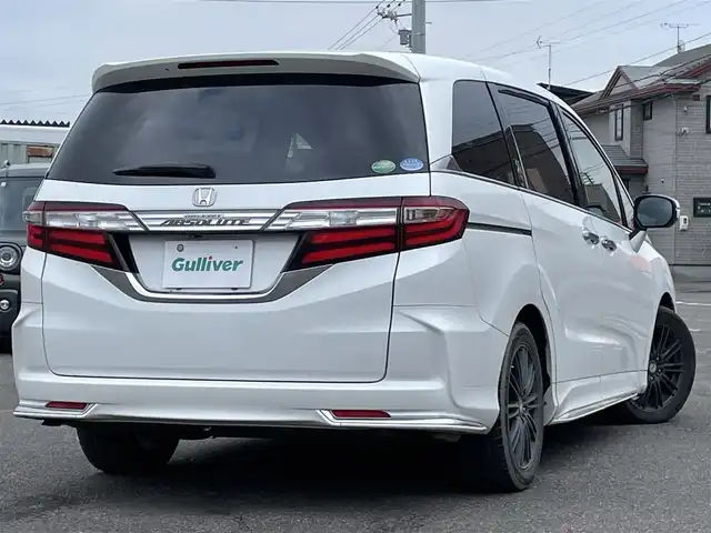 ホンダ オデッセイ アブソルート 20thアニバーサリー 道央・札幌 2014(平26)年 11.1万km ホワイトオーキッドパール 社外メモリーナビ/BT/SD/CD/DVD/社外フリップダウンモニター/衝突被害軽減ブレーキ/横滑り防止装置/クルーズコントロール/ビルトインETC/アイドリングストップ/両側パワースライドドア/D席パワーシート/オットマン/ハーフレザーシート/革巻きステアリング/ステアリングリモコン/パドルシフト/MTモード付AT/レーダー探知機/プッシュスタート/スマートキー/LEDヘッドライト/オートライト/フォグランプ/電動格納ミラー/ヒーテッドドアミラー/ウィンカーミラー/純正フロアマット/スペアキー/社外エンジンスターター