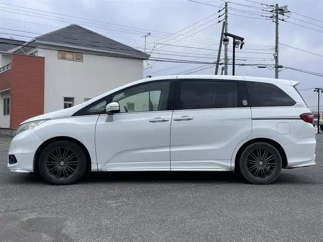 ホンダ オデッセイ アブソルート 20thアニバーサリー 道央・札幌 2014(平26)年 11.1万km ホワイトオーキッドパール 社外メモリーナビ/BT/SD/CD/DVD/社外フリップダウンモニター/衝突被害軽減ブレーキ/横滑り防止装置/クルーズコントロール/ビルトインETC/アイドリングストップ/両側パワースライドドア/D席パワーシート/オットマン/ハーフレザーシート/革巻きステアリング/ステアリングリモコン/パドルシフト/MTモード付AT/レーダー探知機/プッシュスタート/スマートキー/LEDヘッドライト/オートライト/フォグランプ/電動格納ミラー/ヒーテッドドアミラー/ウィンカーミラー/純正フロアマット/スペアキー/社外エンジンスターター