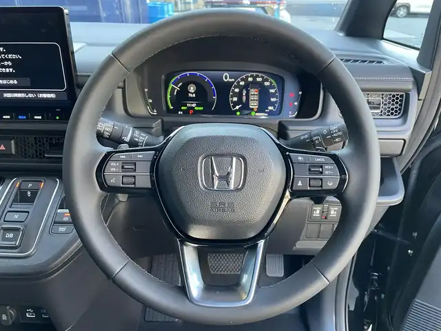 ホンダ ステップワゴン スパーダ eHEV 滋賀県 2025(令7)年 0.1千km クリスタルブラックパール 登録済未使用車/純正11.4インチナビ/【Bluetooth/CD/DVD/フルセグTV/Apple Carplay/Android Auto】/両側パワースライドドア/ハーフレザーシート/バックカメラ/ホンダセンシング/・衝突軽減ブレーキ/・先行車発進お知らせ機能/・歩行者事故低減ステアリング/・路外逸脱抑制機能/・標識認識機能/・渋滞追従機能付アダプティブクルーズコントロール/・車線維持支援システム/・トラフィックジャムアシスト（渋滞運転支援機能）/・ブラインドスポットインフォメーション/・誤発進抑制機能/・後方誤発進抑制機能/・近距離衝突軽減ブレーキ/・急アクセル抑制機能/・パーキングセンサーシステム/・オートハイビーム/・アダプティブドライビングビーム/LEDヘッドライト/パワーバックドア/D/Nシートヒーター/二列目オットマン/後席サンシェード/パドルシフト/プッシュスタート/スマートキー/ステアリングリモコン