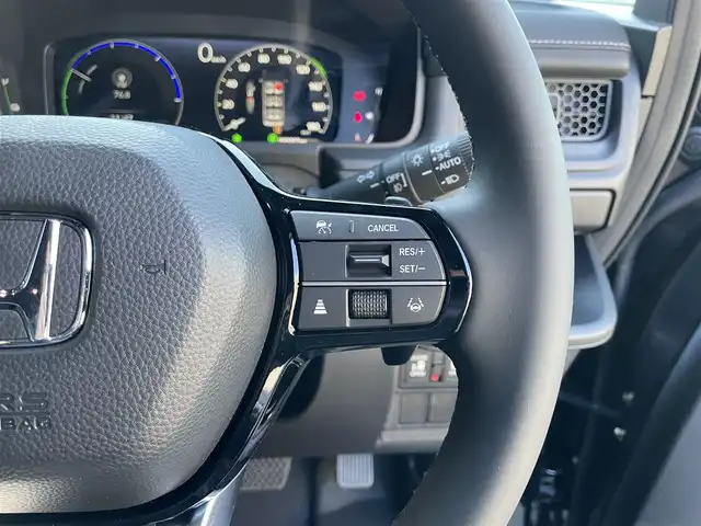 ホンダ ステップワゴン スパーダ eHEV 滋賀県 2025(令7)年 0.1千km クリスタルブラックパール 登録済未使用車/純正11.4インチナビ/【Bluetooth/CD/DVD/フルセグTV/Apple Carplay/Android Auto】/両側パワースライドドア/ハーフレザーシート/バックカメラ/ホンダセンシング/・衝突軽減ブレーキ/・先行車発進お知らせ機能/・歩行者事故低減ステアリング/・路外逸脱抑制機能/・標識認識機能/・渋滞追従機能付アダプティブクルーズコントロール/・車線維持支援システム/・トラフィックジャムアシスト（渋滞運転支援機能）/・ブラインドスポットインフォメーション/・誤発進抑制機能/・後方誤発進抑制機能/・近距離衝突軽減ブレーキ/・急アクセル抑制機能/・パーキングセンサーシステム/・オートハイビーム/・アダプティブドライビングビーム/LEDヘッドライト/パワーバックドア/D/Nシートヒーター/二列目オットマン/後席サンシェード/パドルシフト/プッシュスタート/スマートキー/ステアリングリモコン