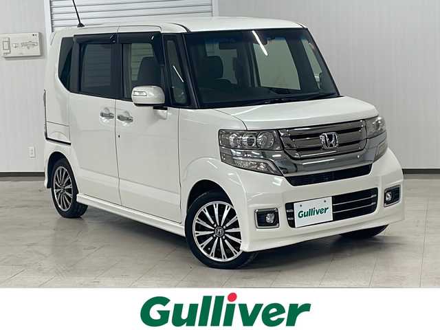 ホンダ Ｎ ＢＯＸ カスタム G ターボ Lパッケージ 熊本県 2015(平27)年 6.7万km プレミアムホワイトパールⅡ MITSUBISHI製メモリナビ/オートライト/ECONスイッチ/パドルシフト/純正フロアマット/ドアバイザー/CTBA/ドアロック連動ミラー/ステアリングスイッチ/ETC/両側パワースライドドア/革巻きステアリング