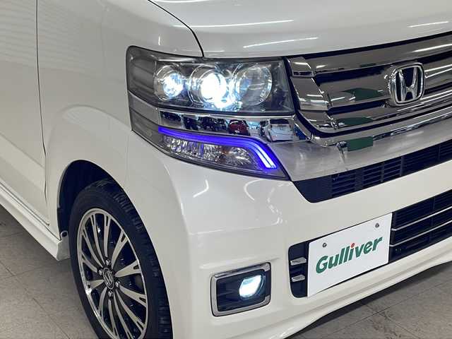 ホンダ Ｎ ＢＯＸ カスタム G ターボ Lパッケージ 熊本県 2015(平27)年 6.7万km プレミアムホワイトパールⅡ MITSUBISHI製メモリナビ/オートライト/ECONスイッチ/パドルシフト/純正フロアマット/ドアバイザー/CTBA/ドアロック連動ミラー/ステアリングスイッチ/ETC/両側パワースライドドア/革巻きステアリング
