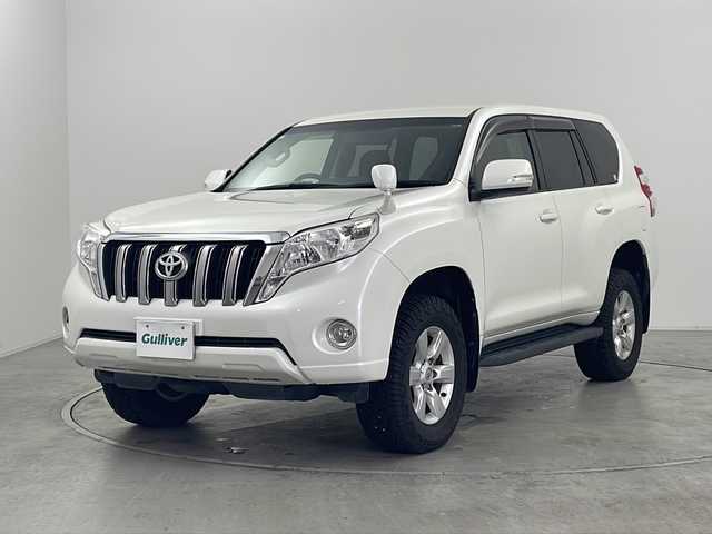トヨタ ランドクルーザー プラド TX 群馬県 2017(平29)年 7.7万km ホワイトパールクリスタルシャイン 雹害　純正ナビ　９型後席モニター　バックカメラ　フルセグＴＶ　ルーフキャリア　４ＷＤ　ビルトインＥＴＣ２．０　ＭＴモード付ＡＴ　横滑り防止機能　オートライト　スマートキー　プッシュスタート　禁煙車