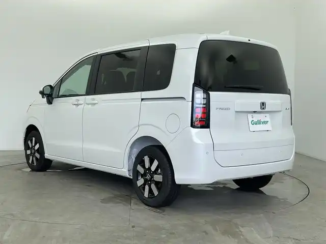 ホンダ フリード ハイブリット e:HEV AIR EX 富山県 2025(令7)年 0.1千km プラチナホワイトパール 登録済未使用車/4WD/純正9型ナビ（AM/FM/BT/USB/フルセグ）/バックカメラ/両側パワースライドドア/オートホールド付電子パーキング/ハーフレザーシート/シートヒーター/ブラインドスポットモニター/衝突被害軽減システム/レーダークルーズコントロール/レーンキープアシスト/コーナーセンサー/横滑り防止装置/純正アルミホイール/オートLEDライト/革巻きステアリング/ステアリングスイッチ