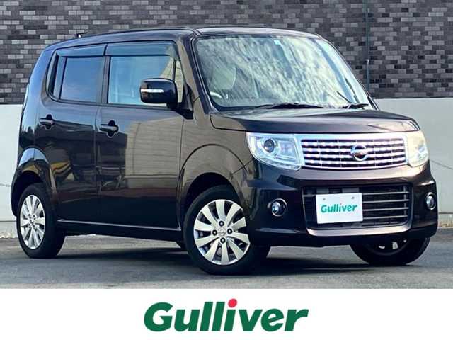 日産 モコ ドルチェX 静岡県 2015(平27)年 4.9万km アーバンブラウン エンジンスタートボタン/パワーウィンドウ/パワーステアリング/取扱説明書/アイドリングストップ/スマートキー/オートエアコン/ETC/純正ナビ/純正フロアマット/純正アルミホイール/合皮シート/ABS/盗難防止装置/オートライト/キセノン/Wエアバッグ/ナビ不良/前ナンバープレート台座ワレ