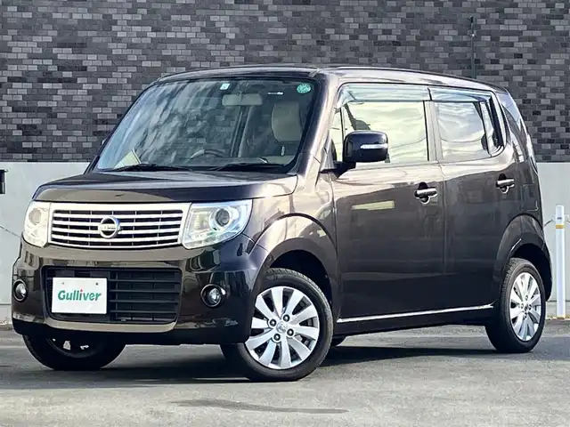 日産 モコ ドルチェX 静岡県 2015(平27)年 4.9万km アーバンブラウン エンジンスタートボタン/パワーウィンドウ/パワーステアリング/取扱説明書/アイドリングストップ/スマートキー/オートエアコン/ETC/純正ナビ/純正フロアマット/純正アルミホイール/合皮シート/ABS/盗難防止装置/オートライト/キセノン/Wエアバッグ/ナビ不良/前ナンバープレート台座ワレ