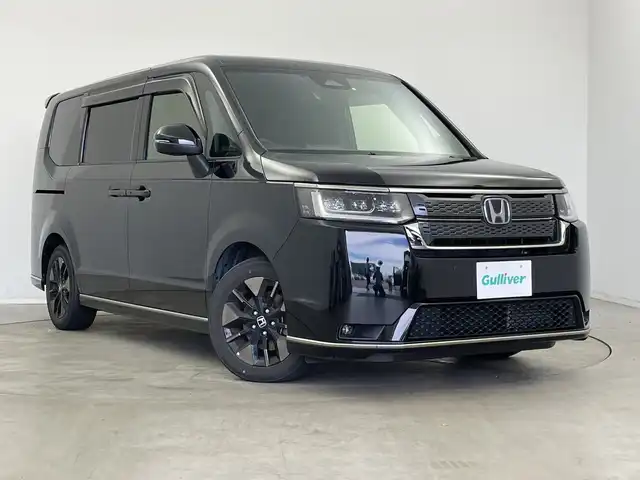 ホンダ ステップワゴン スパーダ eHEV 新潟県 2022(令4)年 6.1万km クリスタルブラックパール 純正メモリナビ/　フルセグTV/Bluetooth/CD/DVD/USB/HDMI/レーダークルーズコントロール/ブラインドスポットインフォメーション/衝突被害軽減ブレーキ/レーンキープアシスト/前後コーナーセンサー/パワーバックドア/ハーフレザーシート/前席シートヒーター/両側パワースライドドア/前後ドライブレコーダー/バックモニター/ビルトインETC/横滑り防止装置/LEDヘッドライト/オートマチックハイビーム/オートライト/パドルシフト/レザーステアリング/ステアリングスイッチ/禁煙車