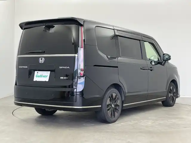 ホンダ ステップワゴン スパーダ eHEV 新潟県 2022(令4)年 6.1万km クリスタルブラックパール 純正メモリナビ/　フルセグTV/Bluetooth/CD/DVD/USB/HDMI/レーダークルーズコントロール/ブラインドスポットインフォメーション/衝突被害軽減ブレーキ/レーンキープアシスト/前後コーナーセンサー/パワーバックドア/ハーフレザーシート/前席シートヒーター/両側パワースライドドア/前後ドライブレコーダー/バックモニター/ビルトインETC/横滑り防止装置/LEDヘッドライト/オートマチックハイビーム/オートライト/パドルシフト/レザーステアリング/ステアリングスイッチ/禁煙車