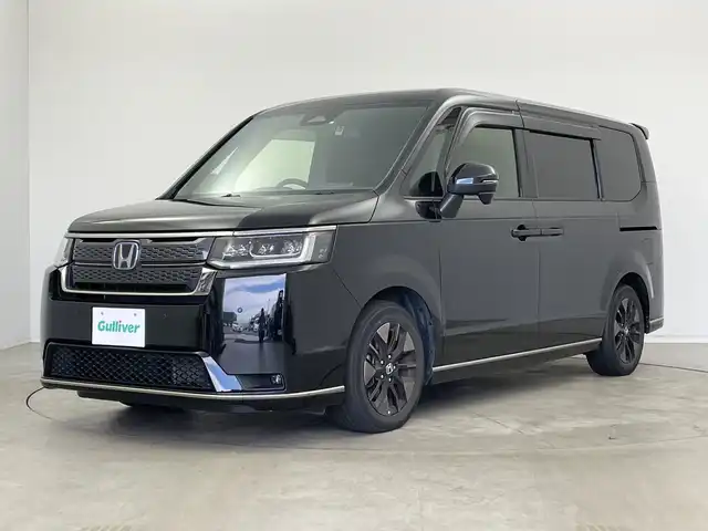 ホンダ ステップワゴン スパーダ eHEV 新潟県 2022(令4)年 6.1万km クリスタルブラックパール 純正メモリナビ/　フルセグTV/Bluetooth/CD/DVD/USB/HDMI/レーダークルーズコントロール/ブラインドスポットインフォメーション/衝突被害軽減ブレーキ/レーンキープアシスト/前後コーナーセンサー/パワーバックドア/ハーフレザーシート/前席シートヒーター/両側パワースライドドア/前後ドライブレコーダー/バックモニター/ビルトインETC/横滑り防止装置/LEDヘッドライト/オートマチックハイビーム/オートライト/パドルシフト/レザーステアリング/ステアリングスイッチ/禁煙車