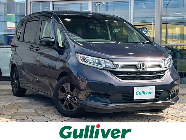 ホンダ フリード G ブラックスタイル 静岡県 2022(令4)年 1.5万km トワイライトミストブラックパール 純正メモリナビ/・CD/・DVD/・フルセグＴＶ/・Bluetooth/・USB/・HDMI/・AM/・FM/主要装備/・両側パワスラ/・衝突軽減/・レーンキープ/・追従クルコン/・コーナーセンサー後/・バックカメラ/・ドラレコ前後/・ビルトインＥＴＣ/・シートヒーター/・LEDヘッドライト/・アクティブコーナリングライト/・ステリモ/・スマートキー/・プッシュスタート/・純正フロアマット/・純正アルミホイール