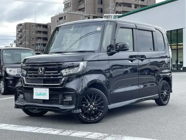 ホンダ Ｎ ＢＯＸ カスタム L ターボ 長野県 2023(令5)年 2.9万km クリスタルブラックパール 純正９型メモリナビ(AM/FM/TV/Bluetooth/DVD)/ターボ過給機/バックカメラ/純正15インチAW/Bluetooth/フルセグTV/ETC/前後ドライブレコーダー/両側電動スライドドア/ハーフレザーシート/前席シートヒーター/後方コーナーセンサー/アダプティブクルーズコントロール/プリクラッシュセーフティ/レーンキープアシスト/レーン逸脱警報装置/空気清浄/ＵＳＢ入力端子/ウィンカーミラー/パドルシフト/ＭＴモード付ＡＴ/革巻きステアリング/ステアリングスイッチ/純正エアロパーツ/純正フロアマット/純正ＬＥＤライト/フォグランプ/オートライト/アダプティブハイビームシステム/エアバック(Ｗ＋サイド＋カーテン)/プッシュスタート/オートエアコン/アイドリングストップ/スマートキー