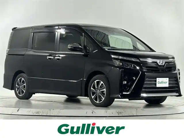 トヨタ ヴォクシー ZS 煌 佐賀県 2018(平30)年 8.6万km ブラック アルパイン製11インチナビ/フルセグTV/CD/DVD/Bluetooth/バックカメラ　/衝突被害軽減システム/オートライト/オートマチックハイビーム/LEDヘッドライト/LEDフォグライト/前後ドライブレコーダ/ビルトインETC/横滑り防止装置/両側パワースライドドア/後席サンシェード/助手席側シートバックテーブル/ISOFIX対応シート/ダブルエアコン/純正フロアマット/純正16インチアルミホイール/スマートキー/スペアキー×１/プッシュスタート