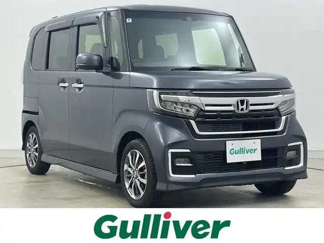 ホンダ Ｎ ＢＯＸ カスタム L 岡山県 2022(令4)年 2.1万km メテオロイドグレーメタリック 9インチフローティングナビ/（MDV-M909HDF）/・FM/AM/Bluetooth/フルセグ/CD/DVD/HDMI/バックカメラ/・フロントカメラ/シートヒーター/片側パワースライドドア/ホンダセンシング/・衝突軽減ブレーキ/・車線逸脱警報/・アダプティブクルーズコントロール/・オートハイビーム/・バックソナー/純正フロアマット/LEDヘッドライト/純正アルミ/後席サンシェード/シートバックテーブル/新車保証書/取扱説明書/スペアキー×１