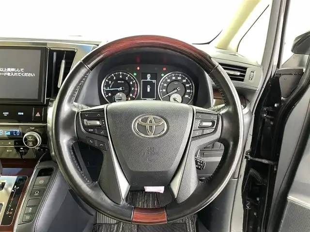 トヨタ ヴェルファイア V 福井県 2016(平28)年 3.3万km ブラック 純正ナビ　/型式：NSZN-Z66T/【AM/FM/Bluetooth/フルセグTV】/クルーズコントロール/両側パワースライドドア/電動パーキング/ブレーキホールド/パワーシート（Ｄ席）/プッシュスタート/スマートキー/ＥＴＣ/横滑り防止機能/ステアリングスイッチ/フォグランプ/LEDヘッドライト/ウインカーミラー/電格ミラー/ウォークスルー/サンシェード（セカンドシート）