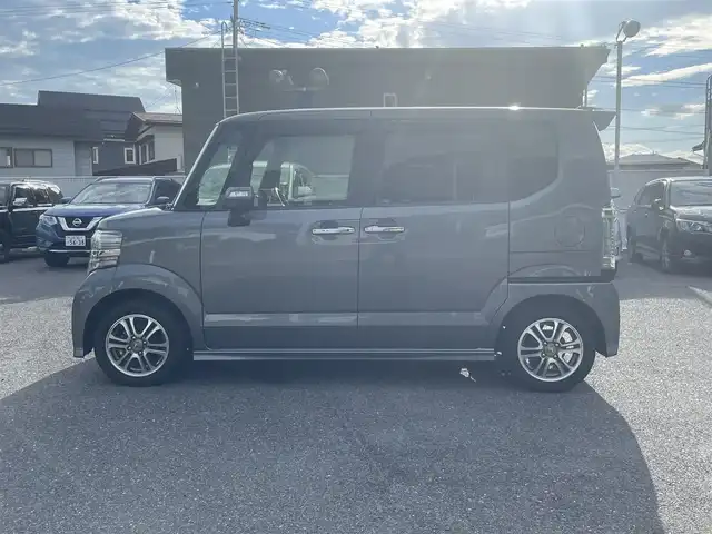 ホンダ Ｎ ＢＯＸ カスタム G Lパッケージ 山形県 2015(平27)年 6.9万km ポリッシュドメタルメタリック (株)IDOMが運営する【じしゃロン山形店】の自社ローン専用車両になります。/こちらは現金またはオートローンご利用時の価格です。/自社ローンご希望の方は別途その旨お申付け下さい。/Gathersナビ/両側パワースライドドア/バックカメラ/ETC/プッシュスタート/Bluetooth/スマートキー/ISOFIX/横滑り防止/純正フロアマット