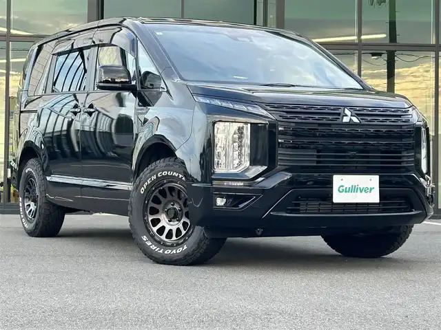 三菱 デリカＤ：５ シャモニー 愛媛県 2024(令6)年 3.3万km 黒Ⅱ シャモニー専用撥水シート/DELTAFORCE製18インチアルミホイール/純正11インチメモリナビ/CD/DVD/BT/MSV/iPod/DTV/HDMI/バックカメラ/ETC/パドルシフト/レーダークルーズコントロール/レーンキープアシストシステム/衝突被害軽減ブレーキ/D席パワーシート/D＋N席シートヒーター/両側電動スライドドア/電動サイドステップ/LEDヘッドライト/オートライト/オートマチックハイビーム/電動リアゲート/革巻きステアリング/ステアリングスイッチ/純正フロアマット/ドアバイザー/プッシュスタート/スマートキー