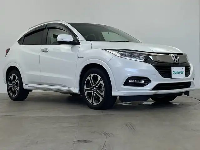 ホンダ ヴェゼル ハイブリッド Z ホンダセンシング 鹿児島県 2018(平30)年 5.4万km プラチナホワイトパール 純正SDナビ/（AM/FM/CD/DVD/Bluetooth/フルセグ）/バックカメラ/ホンダセンシング/レーダークルーズコントロール/レーンキープアシスト/衝突被害軽減ブレーキ/ビルトインETC/ステアリングリモコン/横滑り防止装置/ドアバイザー/フロアマット/スマートキー/電子パーキング