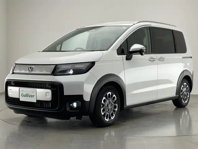 ホンダ フリード ハイブリット e:HEV クロスター 愛知県 2025(令7)年 0.1千km プラチナホワイトパール 登録済未使用車　純正９型ナビ　フルセグＴＶ　Ｂｌｕｅｔｏｏｔｈ　ＵＳＢ　ＢＳＭ　シートヒーター　ハーフレザー　両側パワースライドドア　ホンダセンシング　衝突軽減　追従クルコン　ＬＥＤオートライト　禁煙/e:HEV クロスター　2LE40P3　6人　9インチナビ　LXM-242ZFNI(207680円)