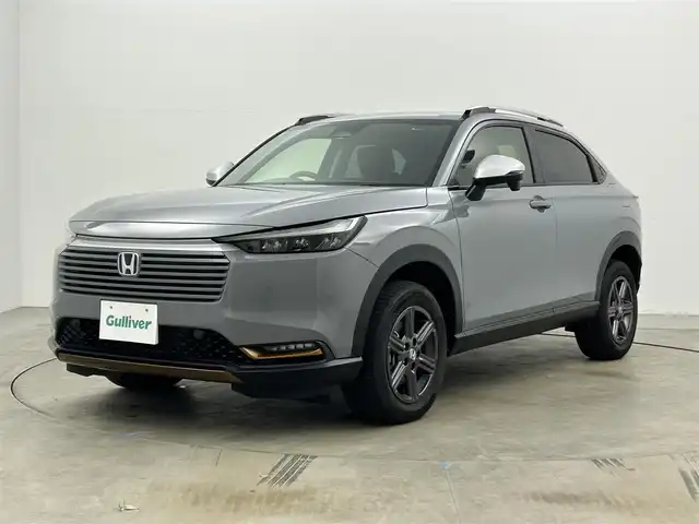 ホンダ ヴェゼル ハイブリッド e:HEV X HuNTパッケージ 岡山県 2024(令6)年 0.3万km グレー 純正９インチナビ　(VXU-２４５VZi)/【CD/DVD/BT/SD/フルセグ/Carplay】/ＬＥＤヘッドライト　/レーダークルーズコントロール/バックカメラ　/コーナーセンサー/オートハイビーム　/スマートキー　/スペアキー×1/レーンキープアシスト　/ミュージックサーバー　/フォグランプ/禁煙車/オートブレーキホールド/パドルシフト