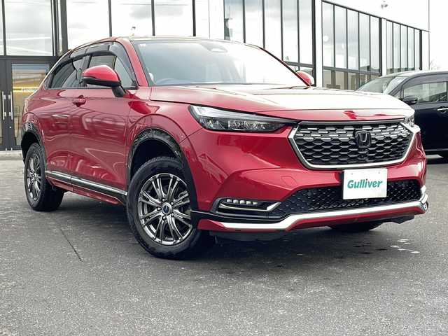ホンダ ヴェゼル ハイブリッド e:HEV Z 青森県 2021(令3)年 5.1万km プレミアムクリスタルレッドM ・寒冷地仕様/・4WD/・純正ナビ/・AM/FM/BT/フルセグ/・全方位バックカメラ/・横滑り防止装置/・衝突被害軽減ブレーキ/・レーンキープアシスト/・クルーズコントロール追従/・ブライドスポットモニター/・コーナーセンサー/・パドルシフト/・前後ドライブレコーダー/・ETC2.0/・ハーフレザーシート/・LEDヘッドライト/・パワーバックドア/・シートヒーター/・ステアリングヒーター/・ワイヤレス充電/・オートライト/・USBソケット/・純正フロアマット/・純正夏タイヤ16インチAW積込/・保証書/取説