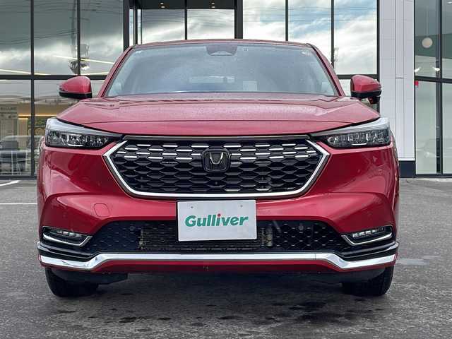 ホンダ ヴェゼル ハイブリッド e:HEV Z 青森県 2021(令3)年 5.1万km プレミアムクリスタルレッドM ・寒冷地仕様/・4WD/・純正ナビ/・AM/FM/BT/フルセグ/・全方位バックカメラ/・横滑り防止装置/・衝突被害軽減ブレーキ/・レーンキープアシスト/・クルーズコントロール追従/・ブライドスポットモニター/・コーナーセンサー/・パドルシフト/・前後ドライブレコーダー/・ETC2.0/・ハーフレザーシート/・LEDヘッドライト/・パワーバックドア/・シートヒーター/・ステアリングヒーター/・ワイヤレス充電/・オートライト/・USBソケット/・純正フロアマット/・純正夏タイヤ16インチAW積込/・保証書/取説