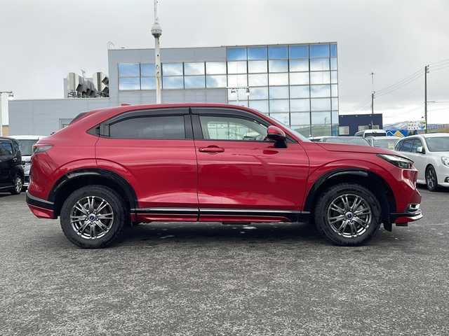 ホンダ ヴェゼル ハイブリッド e:HEV Z 青森県 2021(令3)年 5.1万km プレミアムクリスタルレッドM ・寒冷地仕様/・4WD/・純正ナビ/・AM/FM/BT/フルセグ/・全方位バックカメラ/・横滑り防止装置/・衝突被害軽減ブレーキ/・レーンキープアシスト/・クルーズコントロール追従/・ブライドスポットモニター/・コーナーセンサー/・パドルシフト/・前後ドライブレコーダー/・ETC2.0/・ハーフレザーシート/・LEDヘッドライト/・パワーバックドア/・シートヒーター/・ステアリングヒーター/・ワイヤレス充電/・オートライト/・USBソケット/・純正フロアマット/・純正夏タイヤ16インチAW積込/・保証書/取説