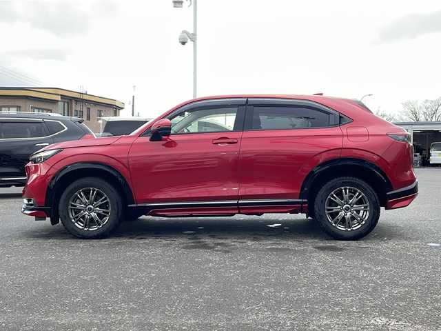 ホンダ ヴェゼル ハイブリッド e:HEV Z 青森県 2021(令3)年 5.1万km プレミアムクリスタルレッドM ・寒冷地仕様/・4WD/・純正ナビ/・AM/FM/BT/フルセグ/・全方位バックカメラ/・横滑り防止装置/・衝突被害軽減ブレーキ/・レーンキープアシスト/・クルーズコントロール追従/・ブライドスポットモニター/・コーナーセンサー/・パドルシフト/・前後ドライブレコーダー/・ETC2.0/・ハーフレザーシート/・LEDヘッドライト/・パワーバックドア/・シートヒーター/・ステアリングヒーター/・ワイヤレス充電/・オートライト/・USBソケット/・純正フロアマット/・純正夏タイヤ16インチAW積込/・保証書/取説