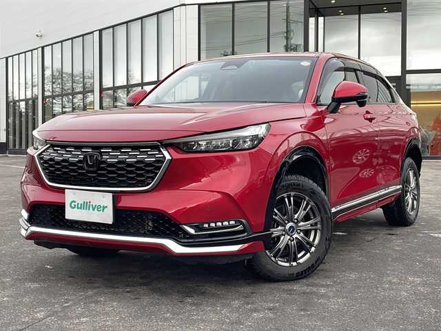 ホンダ ヴェゼル ハイブリッド e:HEV Z 青森県 2021(令3)年 5.1万km プレミアムクリスタルレッドM ・寒冷地仕様/・4WD/・純正ナビ/・AM/FM/BT/フルセグ/・全方位バックカメラ/・横滑り防止装置/・衝突被害軽減ブレーキ/・レーンキープアシスト/・クルーズコントロール追従/・ブライドスポットモニター/・コーナーセンサー/・パドルシフト/・前後ドライブレコーダー/・ETC2.0/・ハーフレザーシート/・LEDヘッドライト/・パワーバックドア/・シートヒーター/・ステアリングヒーター/・ワイヤレス充電/・オートライト/・USBソケット/・純正フロアマット/・純正夏タイヤ16インチAW積込/・保証書/取説