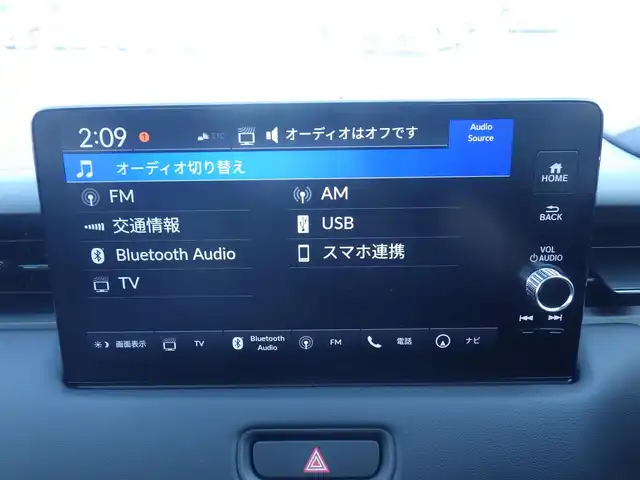ホンダ ヴェゼル ハイブリッド e:HEV Z 千葉県 2025(令7)年 0.1万km未満 プラチナホワイトパール e:HEV Z　3VC4AG3　Honda CONNECTディスプレー+ETC2.0車載器+ワイヤレス充電器(220/000)　フロントグリル　ベルリナブラック(41250円)/ホンダセンシング/・衝突軽減ブレーキ（CMBS）/・車線維持支援システム（LKAS）/・アダプティブクルーズコントロール（ACC）/・後方誤発進抑制機能/・誤発進抑制機能/パワーバックドア/ホンダコネクトナビ/地デジTV/【Bluetooth接続】/【Apple CarPlay　Android Auto対応】/バックカメラ/ワイヤレス充電/革巻きステアリング/ステアリングヒーター/ステアリングスイッチ/パドルシフト/前席シートヒーター/ETC（2.0）/LEDヘッドライト/フォグライト/ウインカーミラー/純正18インチアルミホイル/サイド/カーテンエアバッグ/Honda スマートキー