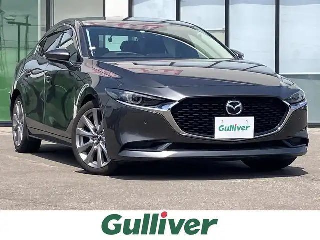 マツダ マツダ３セダン 道南・函館 2020(令2)年 6.7万km マシーングレープレミアムM ・ワンオーナー/・スマートブレーキサポート/・パーキングセンサー/・レーダークルーズコントロール/・ブラインドスポットモニタリング/・BOSEサウンド/・純正メモリナビ/・フルセグTV/・HDMI接続/・全方位モニター/・ETC/・ステアリングヒーター/・前席シートヒーター/・純正LEDヘッドライト/・オートライト/・スマートキー/・エンジンプッシュスタート/・オートブレーキホールド