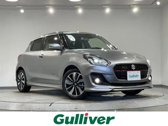 スズキ スイフト RS 愛知県 2018(平30)年 1.3万km プレミアムシルバーメタリック 純正８インチナビ/衝突軽減ブレーキ/レーダークルーズコントロール/車線逸脱警報/シートヒーター/パドルシフト/前後ドライブレコーダー/ビルトインＥＴＣ/バックカメラ/アクセサリーソケット/純正16インチアルミホイール/純正フロアマット/ＬＥＤヘッドライト