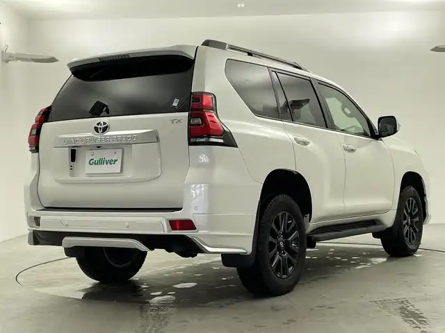 トヨタ ランドクルーザー プラド TX 福井県 2023(令5)年 1.7万km ホワイトパールクリスタルシャイン ・4WD/・サンルーフ/・ルーフレール/・モデリスタエアロ/・ブラックエディション用18インチAW/・トヨタセーフティセンス/・プリクラッシュセーフティ/・レーダークルーズコントロール/・社外9インチSDナビ/(DVD.CD.SD.Bluetooth.フルセグTV)/・バックカメラ/・LEDオートライト/オートハイビーム/・ETC/・トノカバー/・スペアキー×1/・取説/保証書