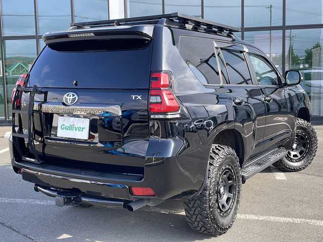 トヨタ ランドクルーザー プラド TX Lパッケージ ブラックED 道東・釧路十勝 2021(令3)年 4.2万km ブラック ・4WD/・7人乗り/・JAOS製BATTLEZ リフトアップセット/・9型ディスプレイオーディオ＋T-コネクトナビキット/（AM/FM/BT/USB/Miracast/フルセグTV）/・スーパーライブサウンドシステム/・Toyota Safety Sense/・マルチテレインモニター/・ブラインドスポットモニター/・レーダークルーズコントロール/・クリアランスソナー/・黒レザーシート/・パワーシート/シートヒーター/エアシート/・ルーフレール/・ルーフキャリア/・サイドステップ/・ヒッチメンバー/・リアラダー/・オートハイビーム/・LEDヘッドライト/・ビルトインETC 2.0