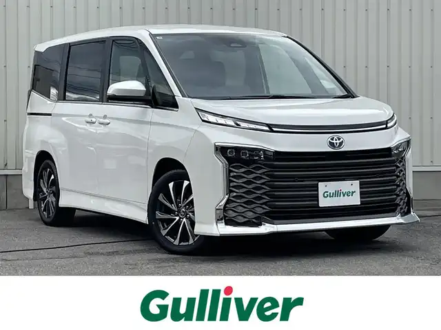 トヨタ ヴォクシー ハイブリッド S－Z 山形県 2025(令7)年 0.1千km ホワイトパールクリスタルシャイン トヨタセーフティセンス/純正ディスプレイオーディオ/　　【CD　DVD　BT　フルセグ　USB】/バックカメラ/両側パワースライドドア/レーダークルーズコントロール/LEDオートライト/ハーフレザーシート/シートヒーター/純正17インチアルミホイール/100V電源/コーナーセンサー/リアオートエアコン/ステアリングスイッチ/スマートキー/ETC2.0