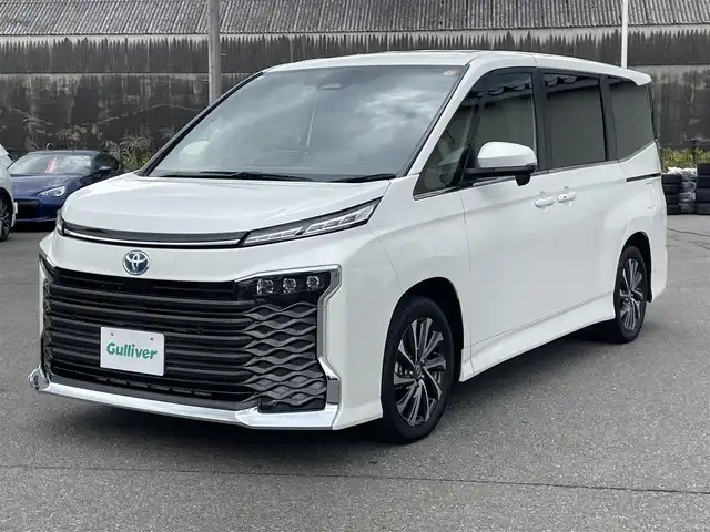 トヨタ ヴォクシー ハイブリッド S－Z 山形県 2025(令7)年 0.1千km ホワイトパールクリスタルシャイン トヨタセーフティセンス/純正ディスプレイオーディオ/　　【CD　DVD　BT　フルセグ　USB】/バックカメラ/両側パワースライドドア/レーダークルーズコントロール/LEDオートライト/ハーフレザーシート/シートヒーター/純正17インチアルミホイール/100V電源/コーナーセンサー/リアオートエアコン/ステアリングスイッチ/スマートキー/ETC2.0