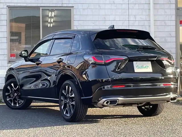 ホンダ ＺＲ－Ｖ ハイブリッド e:HEV Z 福岡県 2024(令6)年 0.6万km クリスタルブラックパール ワンオーナー/BOSEプレミアムサウンド/純正9インチディスプレイオーディオ/　(AM/FM/Bluetooth/フルセグTV/ナビ)/マルチビューカメラ/バック/フロント/サイドカメラ/ホンダセンシング/・衝突軽減ブレーキ/・踏み間違い衝突軽減/・路外逸脱抑制/・歩行者事故低減ステアリング/・先行車発進お知らせ/・標識認識/・オートハイビーム/・アダプティブドライビングビーム/・ブラインドスポットインフォメーション/・パーキングセンサー/・アダプティブクルーズコントロール(渋滞追従機能付)/・車線維持支援/・トラフィックジャムアシスト/横滑り防止/ヒルディセントコントロール/純正18インチアルミホイール/パワーバックドア/パドルシフト/革巻きステアリング/ステアリングスイッチ/ステアリングヒーター/茶色レザーシート/シートメモリー(D)/シートヒーター付きパワーシート(D/N)/コムテック前後ドライブレコーダー【AG425-DRC】/純正ナビ連動型ビルトインETC2.0/純正フロアマット/置くだけ充電/USB端子、タイプC端子/ISOFIX/スペアキー×1/保証書/取扱説明書/ナビ取扱説明書